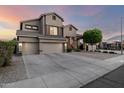 Beautiful home with a three-car garage, a spacious driveway, and a well-maintained yard at 6971 W El Cortez Pl, Peoria, AZ 85383