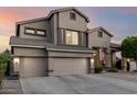 A charming home featuring a convenient three-car garage and a lovely tiled roof at 6971 W El Cortez Pl, Peoria, AZ 85383