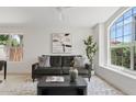 Bright living room featuring a large window, a comfortable sofa, and stylish decor at 732 W Sagebrush St, Gilbert, AZ 85233