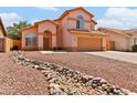 Charming home with a flowing rock river adding unique character to the landscape at 7767 W Sierra Vista Dr, Glendale, AZ 85303