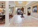 Elegant foyer with soaring ceilings, decorative tile flooring, and grand entryway at 10434 N 44Th N St, Phoenix, AZ 85028