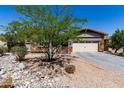 Attractive single-story home with a well-manicured front yard and desert landscaping at 12035 S 186Th Ave, Goodyear, AZ 85338