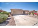 Single-story residence with a two-car garage, providing a comfortable living space and convenient parking at 16887 W Belleview St, Goodyear, AZ 85338