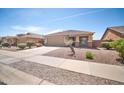 Inviting single-story home with a two-car garage and desert landscaping, offering curb appeal and easy maintenance at 16887 W Belleview St, Goodyear, AZ 85338
