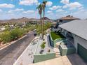 Beautiful home exterior with desert landscaping and stunning mountain views at 1701 E Camino Del Santo --, Phoenix, AZ 85022