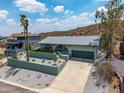 Charming exterior view of home with desert landscaping and front driveway at 1701 E Camino Del Santo --, Phoenix, AZ 85022