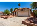 Charming single-story home with desert landscaping, tile roof, and a two-car garage at 18899 N 77Th Ave, Glendale, AZ 85308