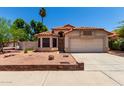 Charming single-story home with desert landscaping, tile roof, and a two-car garage at 18899 N 77Th Ave, Glendale, AZ 85308