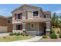 A cozy two-story home with charming red shutters and well-kept landscaping at 2150 E Sunland Ave, Phoenix, AZ 85040