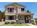 A well-maintained two-story home with red shutters and a covered porch at 2150 E Sunland Ave, Phoenix, AZ 85040