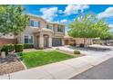 Charming two-story home with a well-manicured lawn and mature trees in a peaceful neighborhood at 2185 E Gillcrest Rd, Gilbert, AZ 85298