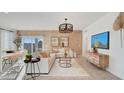 Bright and airy living room featuring stylish furnishings, accent wall, and plenty of natural light at 24052 W Pima St, Buckeye, AZ 85326