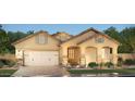 Charming single-story home featuring a spacious garage, brick accents and inviting curb appeal at 2508 E Preston St, Mesa, AZ 85213