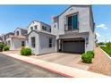 Charming gray two-story home with a two-car garage and beautifully landscaped front yard at 286 E Raleigh Dr, Chandler, AZ 85286