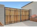This property features a private side yard gate crafted from wood and steel at 30777 W Whitton Ave, Buckeye, AZ 85396
