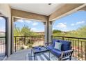 Relaxing balcony features comfortable seating and a view of desert landscape at 3935 E Rough Rider Rd # 1039, Phoenix, AZ 85050