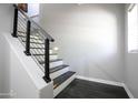 Modern staircase features wooden treads and an industrial style metal railing at 3935 E Rough Rider Rd # 1039, Phoenix, AZ 85050