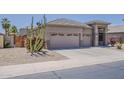Charming single-story home featuring desert landscaping, neutral paint, and a three-car garage at 43319 W Oakland Ct, Maricopa, AZ 85138