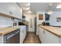 Efficient kitchen featuring butcher block counters, white cabinets, and stainless steel appliances at 4727 E Lafayette Blvd # 211, Phoenix, AZ 85018