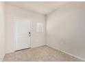 A bright, inviting entryway with a white front door and neutral-toned walls and tile floors at 5240 E Gummite Dr, San Tan Valley, AZ 85143