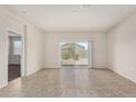 Spacious living room with sliding glass doors leading to the backyard at 5240 E Gummite Dr, San Tan Valley, AZ 85143
