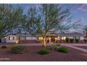 Charming single-story home featuring a well-manicured front yard and walkway under a picturesque sky at 6231 E Desert Cove Ave, Scottsdale, AZ 85254
