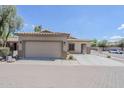 Inviting single-story home with a two-car garage, well-maintained landscaping and a cozy, covered entry at 6317 S Kimberlee Way, Chandler, AZ 85249