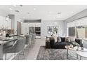 Bright living space with an open floor plan, modern decor, and a view of the kitchen at 7472 E Paraiso Dr, Scottsdale, AZ 85255