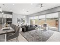 Stylish living room with contemporary furnishings, large windows, and an open floor plan at 7472 E Paraiso Dr, Scottsdale, AZ 85255