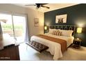 Bedroom with access to balcony and accented with modern design and décor at 9451 E Becker Ln # 1051, Scottsdale, AZ 85260