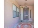 Cozy front porch with decorative tile flooring and a charming pendant light at 10536 W Villa Hermosa --, Peoria, AZ 85383
