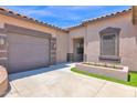 View of home exterior, showing well-kept landscaping, driveway and covered entry at 10536 W Villa Hermosa --, Peoria, AZ 85383
