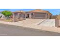 Spacious single-story home with desert landscaping and a wide driveway at 10536 W Villa Hermosa --, Peoria, AZ 85383