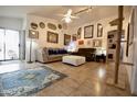 Cozy living room with neutral furniture, tile floors, and a ceiling fan at 11022 N 60Th Dr, Glendale, AZ 85304