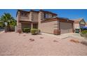 Well-maintained two-story home with desert landscaping at 12422 W Rosewood Dr, El Mirage, AZ 85335