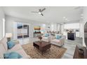 Bright, open-concept living room featuring stylish decor and plenty of natural light at 14178 S Diablo Rd, Arizona City, AZ 85123