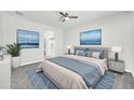 Serene main bedroom with calming decor, large bed, and walk-in closet at 14178 S Diablo Rd, Arizona City, AZ 85123