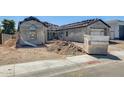 Exterior view of home under construction showing partial scaffolding, cinderblock foundation, and a tan gravel yard at 14687 N 73Rd Dr, Peoria, AZ 85381