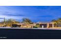 A front view of the property showcasing desert landscaping and an attached two-car garage at 15816 E Eagle Crest Rd, Fountain Hills, AZ 85268
