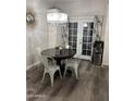 Charming dining area with a round table, stylish chandelier, and easy access to outdoor area at 1601 N Saba St # 255, Chandler, AZ 85225