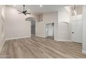 Spacious, light-filled living room featuring vaulted ceilings and wood-look floors at 2189 E Ranch Ct, Gilbert, AZ 85296