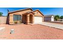 Charming single-story home with desert landscaping and attached two-car garage at 22615 N 31St Dr, Phoenix, AZ 85027