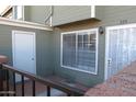 This cozy front porch features an outdoor storage unit and a secure gated entrance to the home at 2301 E University Dr # 334, Mesa, AZ 85213