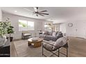 Bright living room with light hardwood floors, stylish furniture, and lots of natural light at 2339 W Ponderosa Ln, Phoenix, AZ 85023