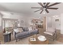 Open concept living area with hardwood floors, neutral decor, and ample seating at 2339 W Ponderosa Ln, Phoenix, AZ 85023