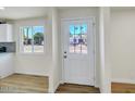 Bright entryway featuring a new door with glass inserts and a modern aesthetic at 3650 E Laurel Ln, Phoenix, AZ 85028