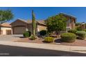 Lovely home showcasing desert landscaping, a low-maintenance yard, and a sprawling three-car garage at 4241 E Andre Ave, Gilbert, AZ 85298