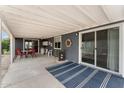 Enjoy outdoor living on this large, covered patio with ample seating and a convenient serving area at 5735 E Mcdowell Rd # 147, Mesa, AZ 85215