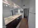 Bathroom featuring dual sinks, modern lighting, and a spacious layout, ensuring comfort and functionality at 6533 N 10Th Pl, Phoenix, AZ 85014