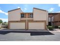Two-story townhouse featuring private garages, neutral exterior and low-maintenance landscaping at 6533 N 10Th Pl, Phoenix, AZ 85014